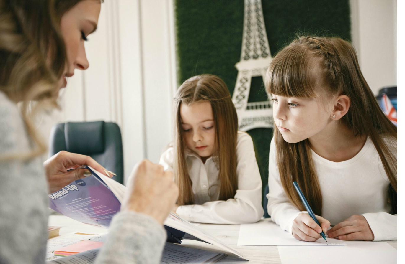 Students studying with a tutor